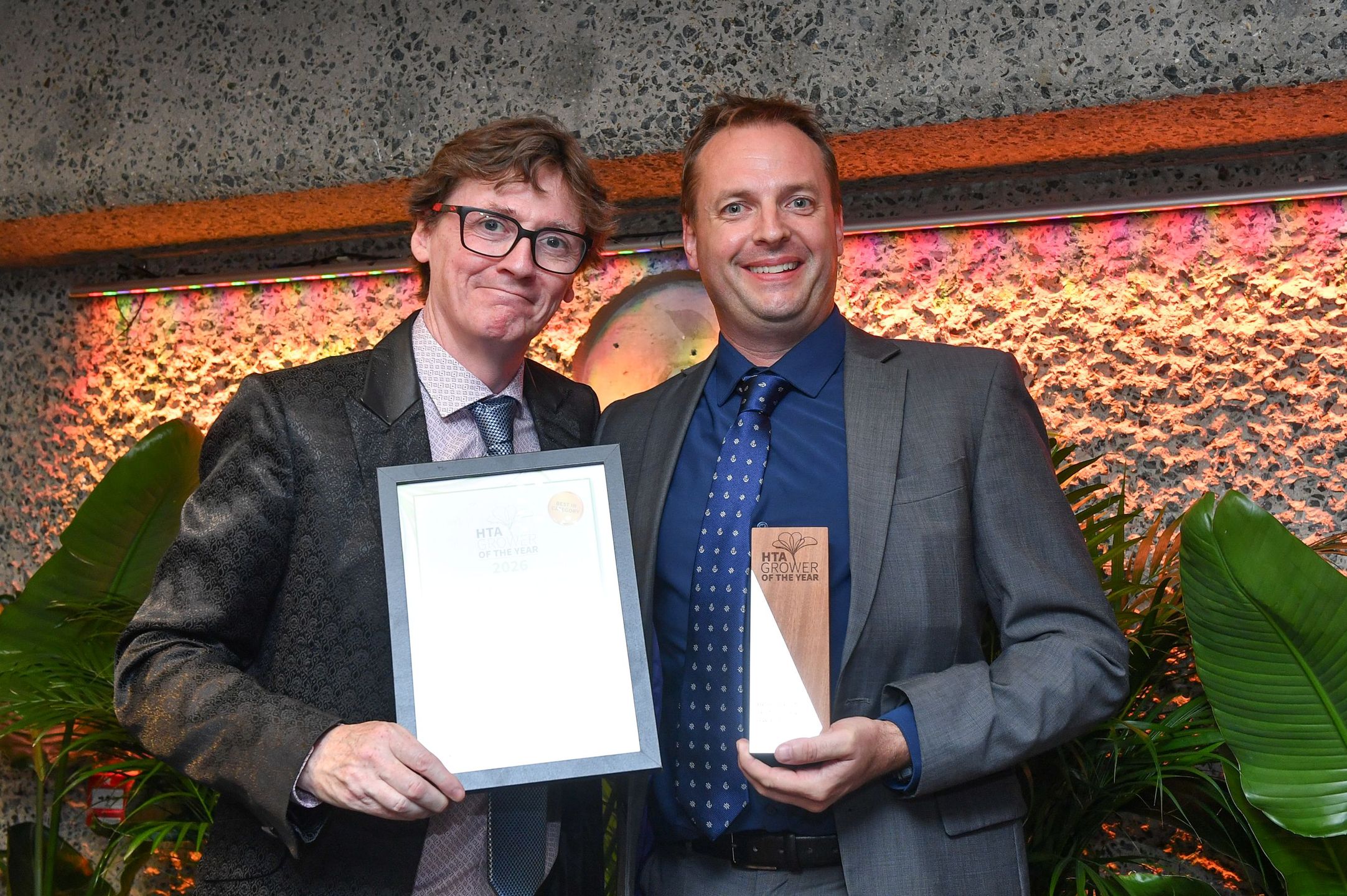 Left comedian and broadcaster Ed Byrne presenting Managing Director Charles James from Frank P Matthews.