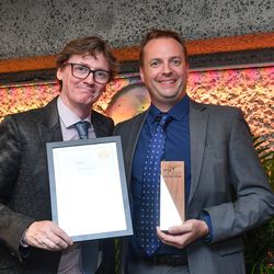 Left comedian and broadcaster Ed Byrne presenting Managing Director Charles James from Frank P Matthews.