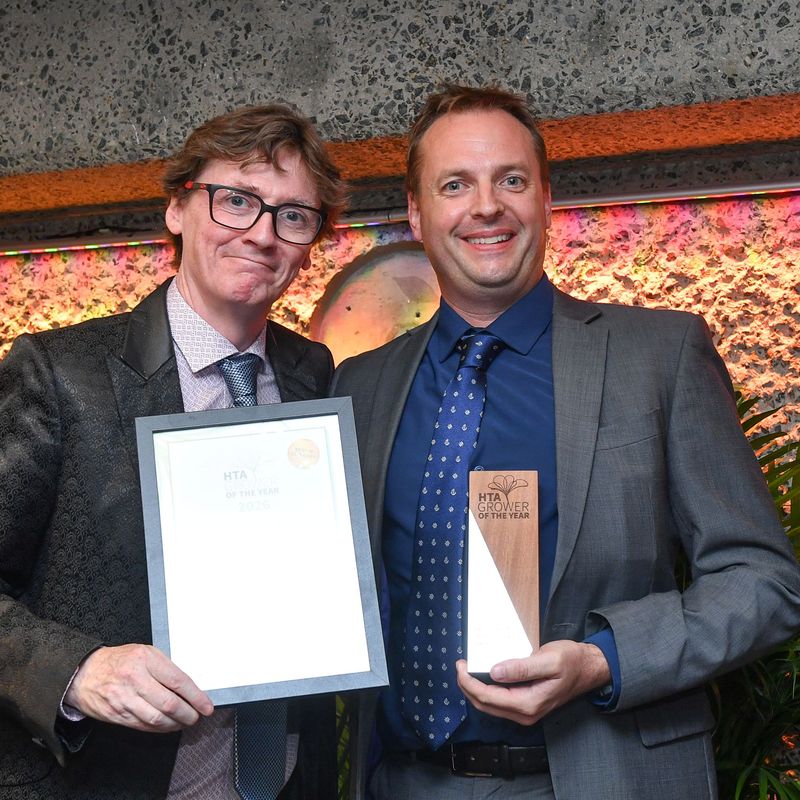 Left comedian and broadcaster Ed Byrne presenting Managing Director Charles James from Frank P Matthews.